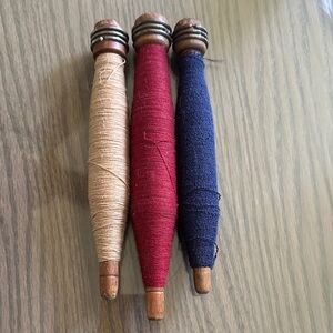 Vintage Wooden Spools with Colorful Thread